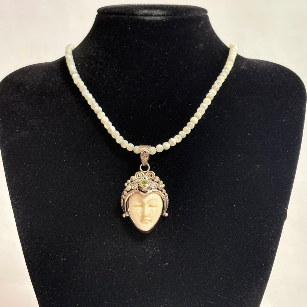 Elegant Silver and Bone Face Pendant Necklace
